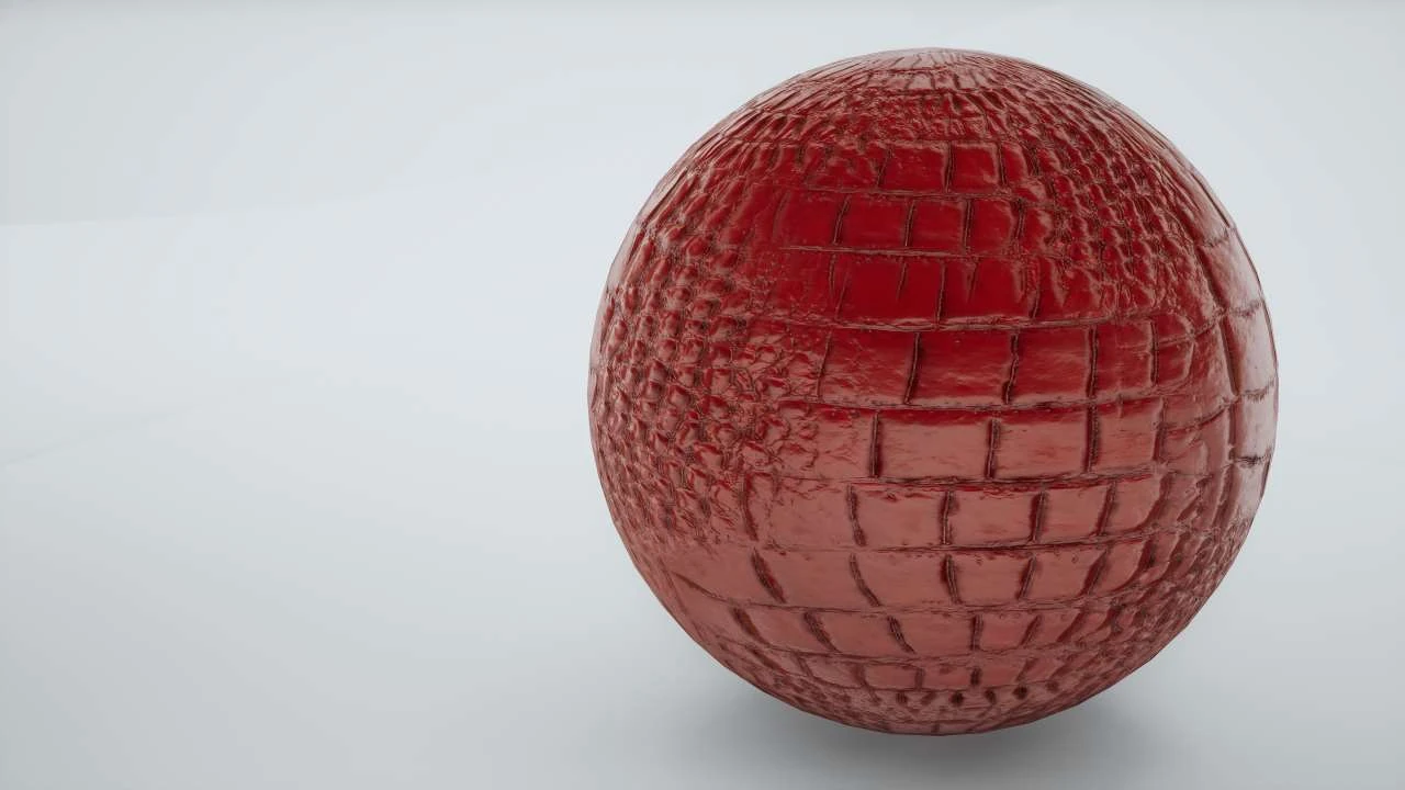The same red test sphere with more pronounced surface relief, reflections and crevice shading